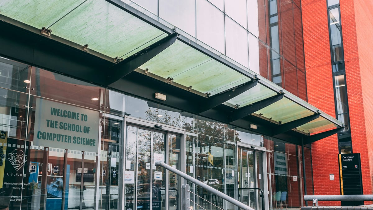 the entrance to a building with a metal hand rail