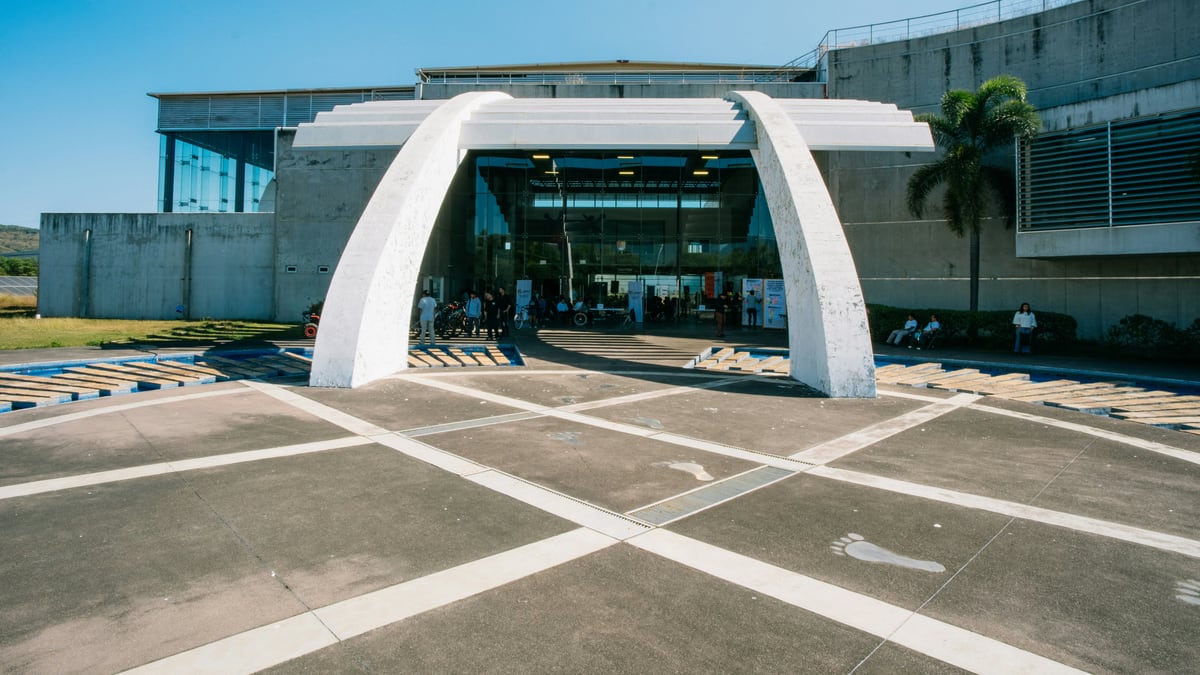 Modern building entrance with a large white archway