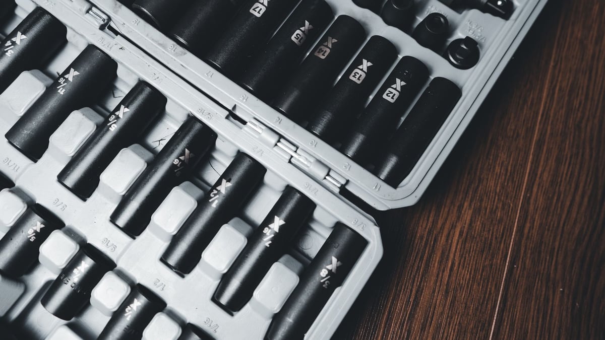 A detailed close-up of a socket tool set neatly arranged in a hard case, ideal for mechanical work.